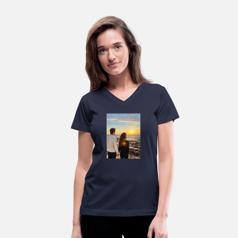 Couple Hand In Hand On Sandy Beach At Sunset